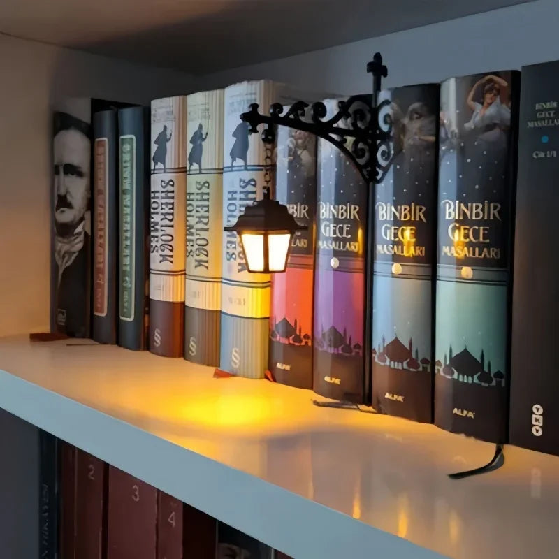 The Lantern hooked over a bookshelf, casting warm amber light across a row of hardcover spines
